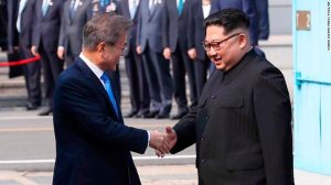 North Korean leader Kim Jong Un, right, shakes hands with South Korean President Moon Jae-in at the border village of Panmunjom in the Demilitarized Zone Friday, April 27, 2018. Kim made history Friday by crossing over the world's most heavily armed border to greet his rival, Moon, for talks on North Korea's nuclear weapons. (Korea Summit Press Pool via AP)